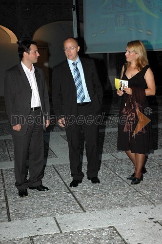 Danilo Ferjančič, direktor Porsche Slovenija in Tadej Sax, vodja programa BMW pri Avto Malgaj z ženo Matejo