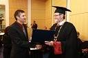 Dr. Aleš Fajmut, dobitnik Srebrnega znaka UM za leto 2009 in prof. dr. Ivan Rozman, rektor Univerze v Mariboru